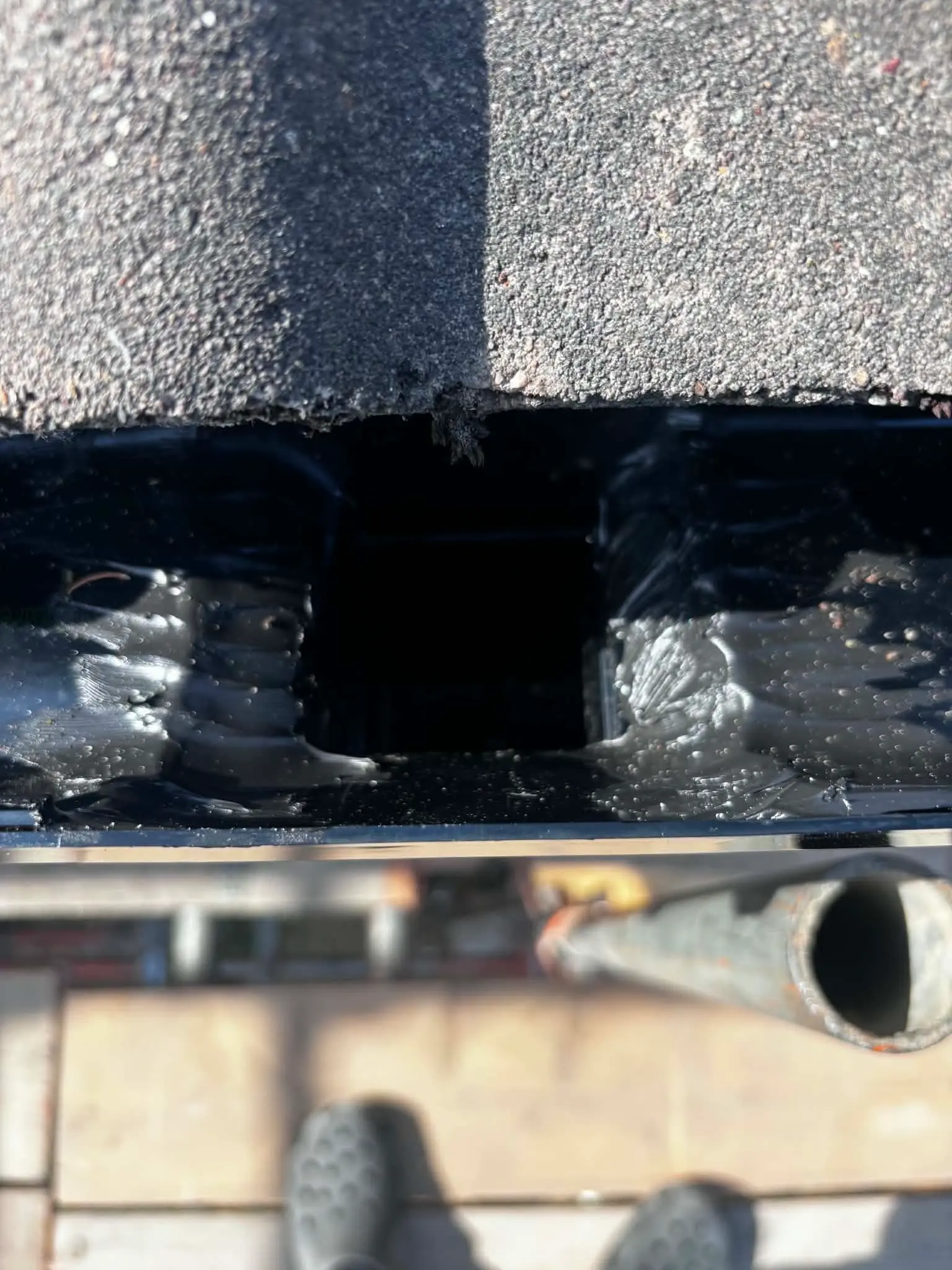 Close-up of gutter joint being repaired